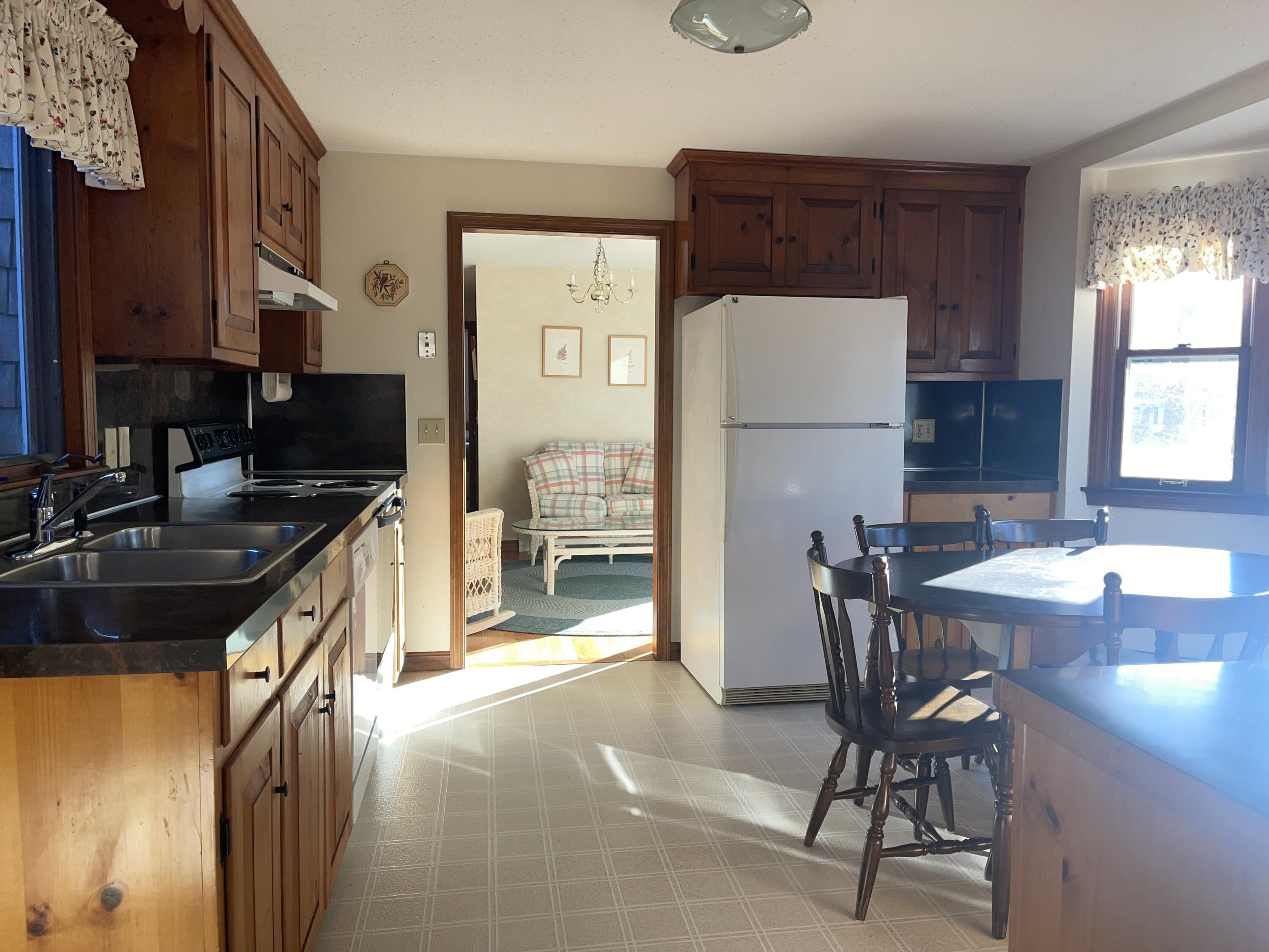 7 Joshua Jethro Road Harwich, MA 02645 - Photo 8 of 14 kitchen to dining room