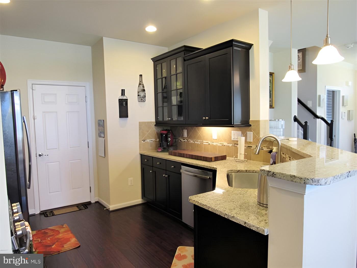 42581 Sunset Ridge Square Ashburn, VA 20148 - Photo 8 of 24 Modern kitchen with sleek finishes.