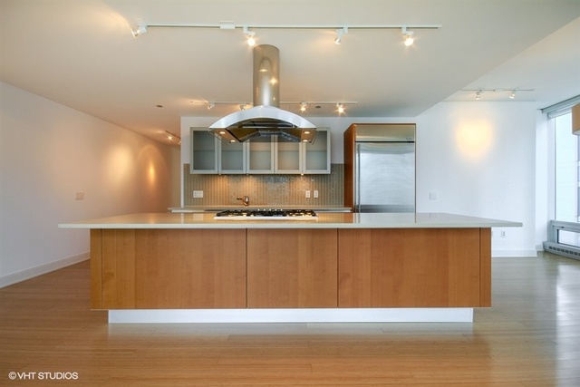 340 East Randolph Street, Unit 1606 Chicago, IL 60601 - Photo 4 of 29 a room with wooden floor
