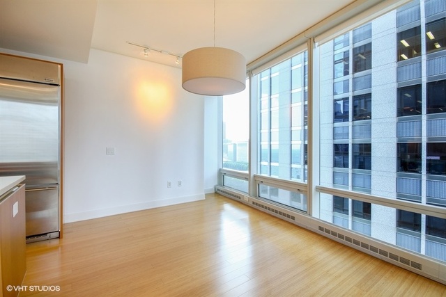340 East Randolph Street, Unit 1606 Chicago, IL 60601 - Photo 8 of 29 a view of a room with windows