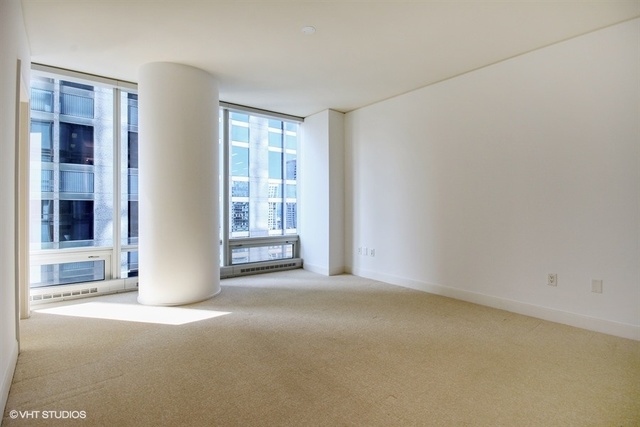 340 East Randolph Street, Unit 1606 Chicago, IL 60601 - Photo 10 of 29 an empty room with windows