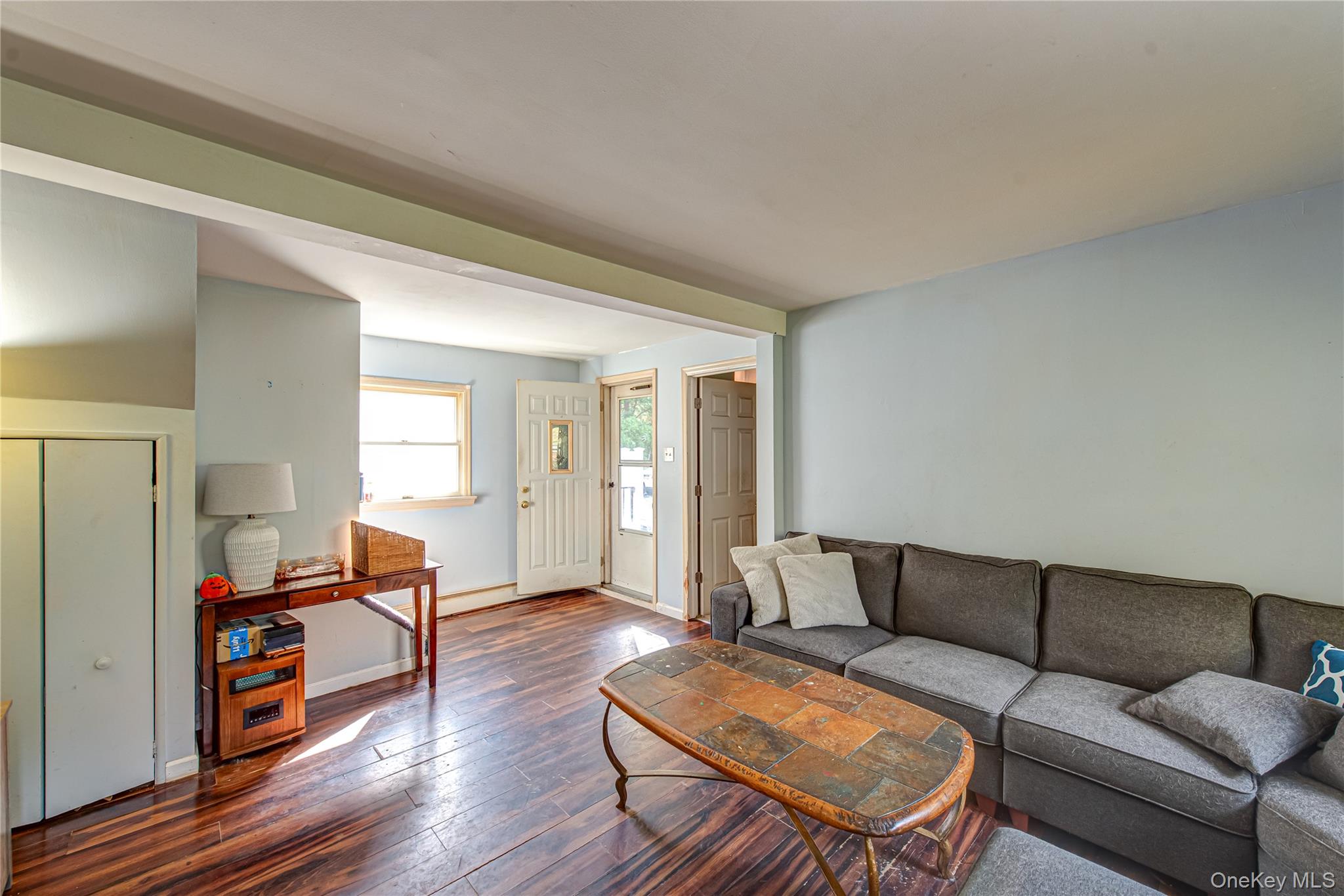 137 Wood Road Centereach, NY 11720 - Photo 2 of 16 a living room with furniture and wooden floor