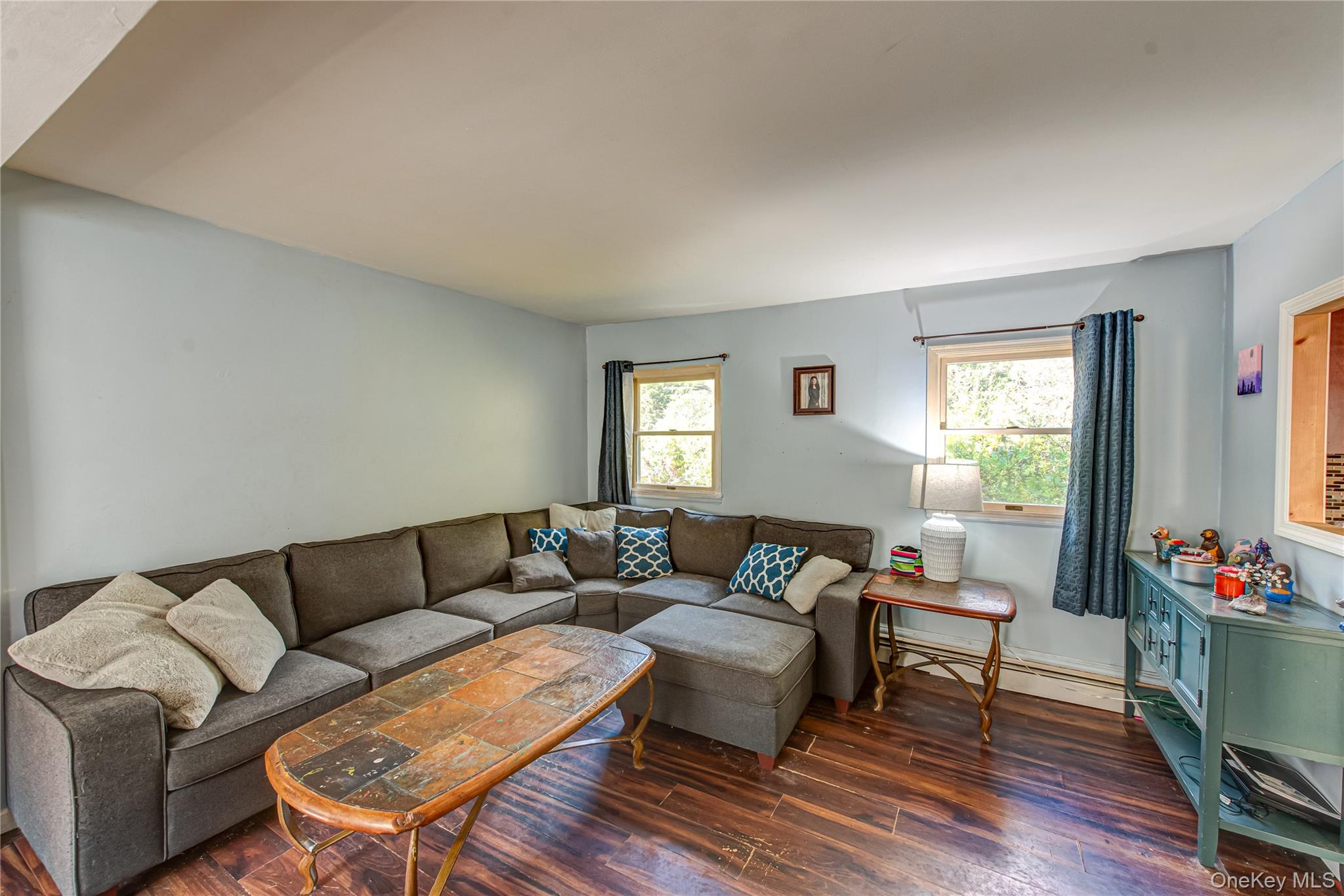 137 Wood Road Centereach, NY 11720 - Photo 3 of 16 a living room with furniture and wooden floor