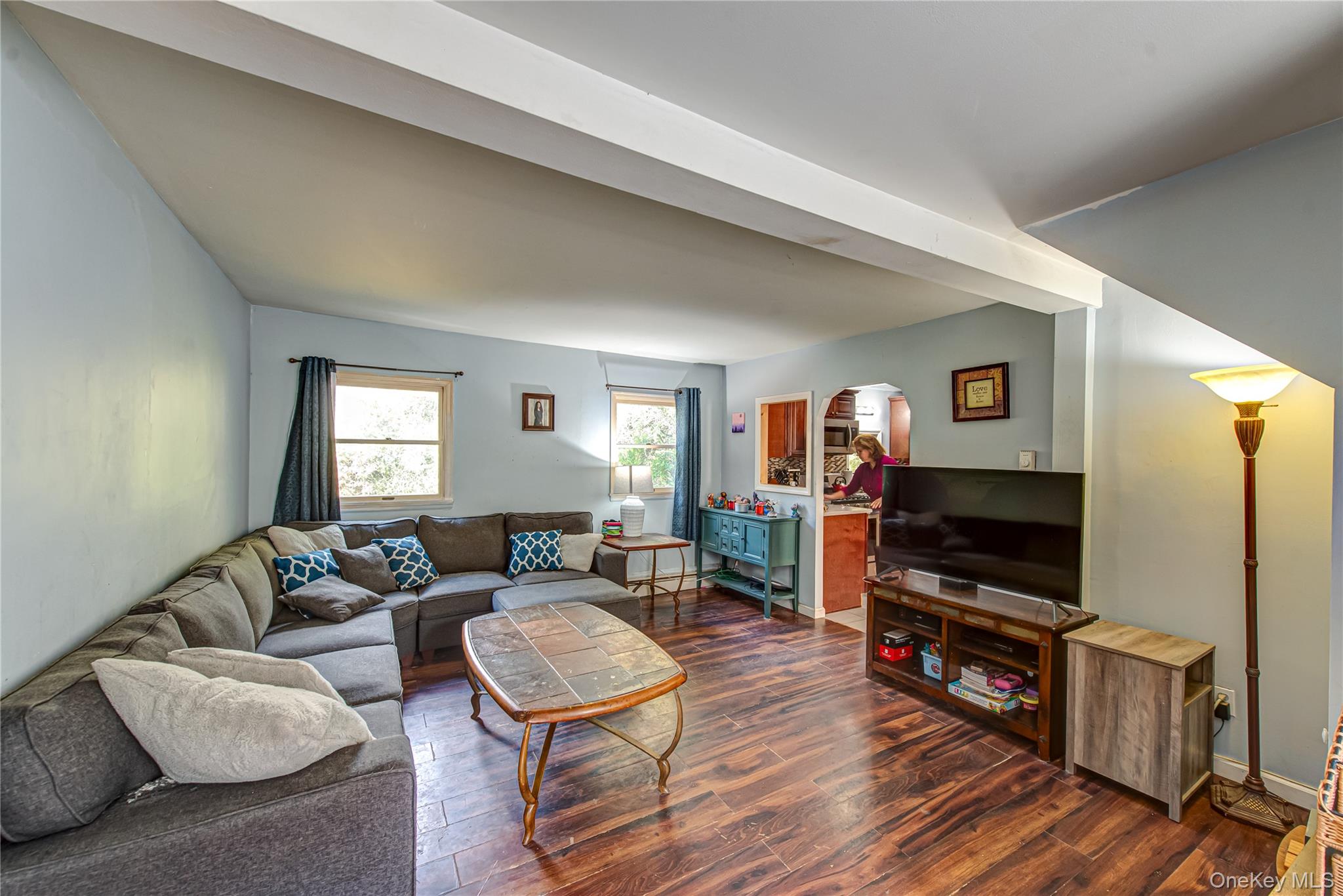 137 Wood Road Centereach, NY 11720 - Photo 4 of 16 a living room with furniture and a flat screen tv