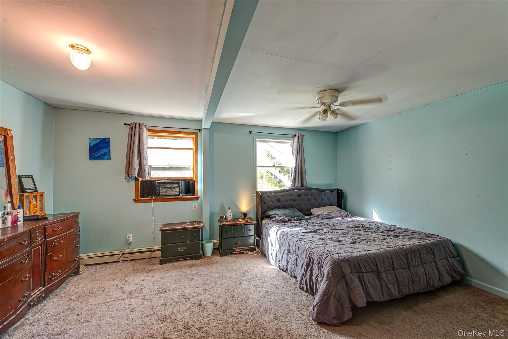 137 Wood Road Centereach, NY 11720 - Photo 8 of 16 a bedroom with a bed and a television