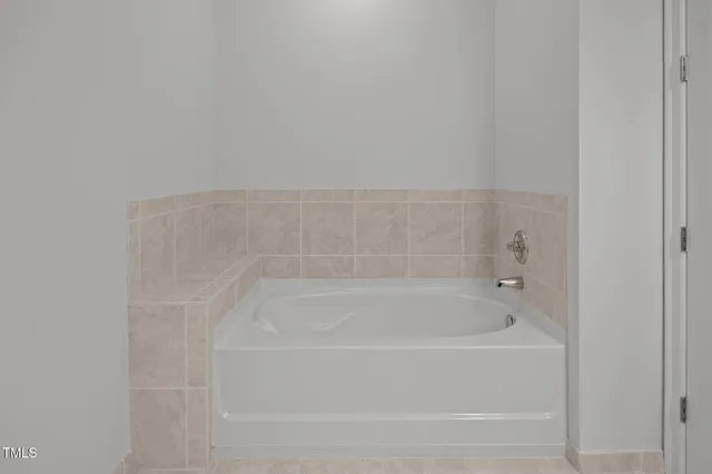 a close up of a bathtub in a bathroom