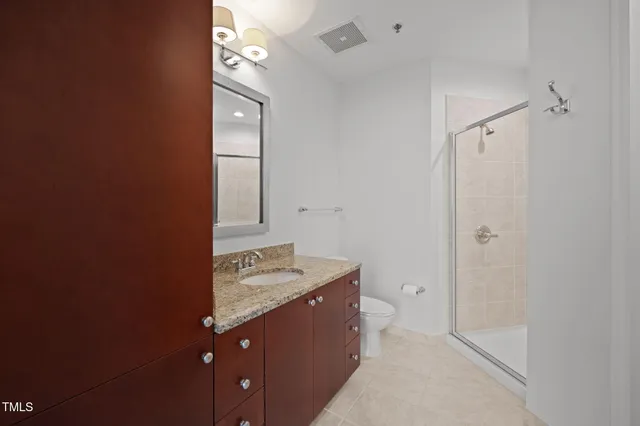 a bathroom with a sink a vanity and a mirror