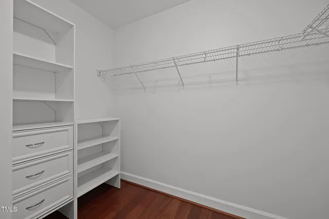 a view of an empty walk in closet
