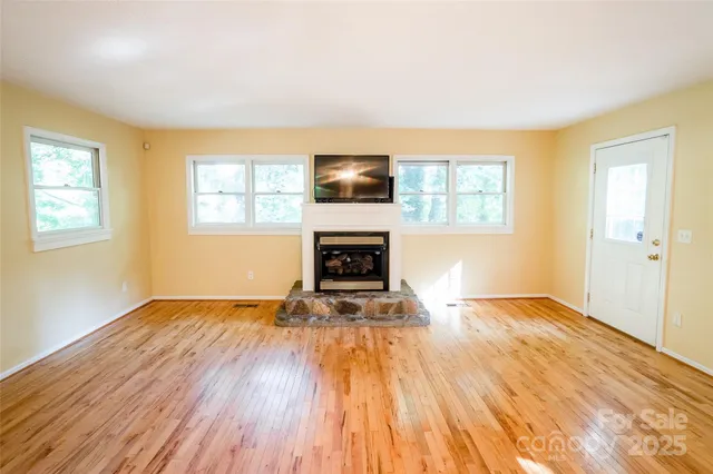 a living room with furniture fireplace and a flat screen tv