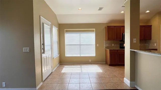 a view of a kitchen with a sink and a window