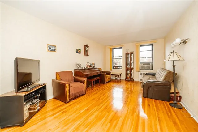 a living room with fireplace furniture and a flat screen tv