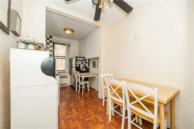 a dining room with furniture and a chandelier