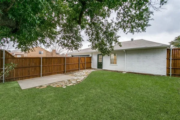 a view of a backyard with a garden