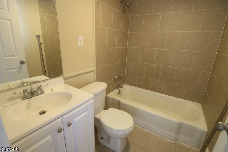 40 Mitchell Street West Orange, NJ 07052 - Photo 15 of 17 a bathroom with a sink toilet and shower