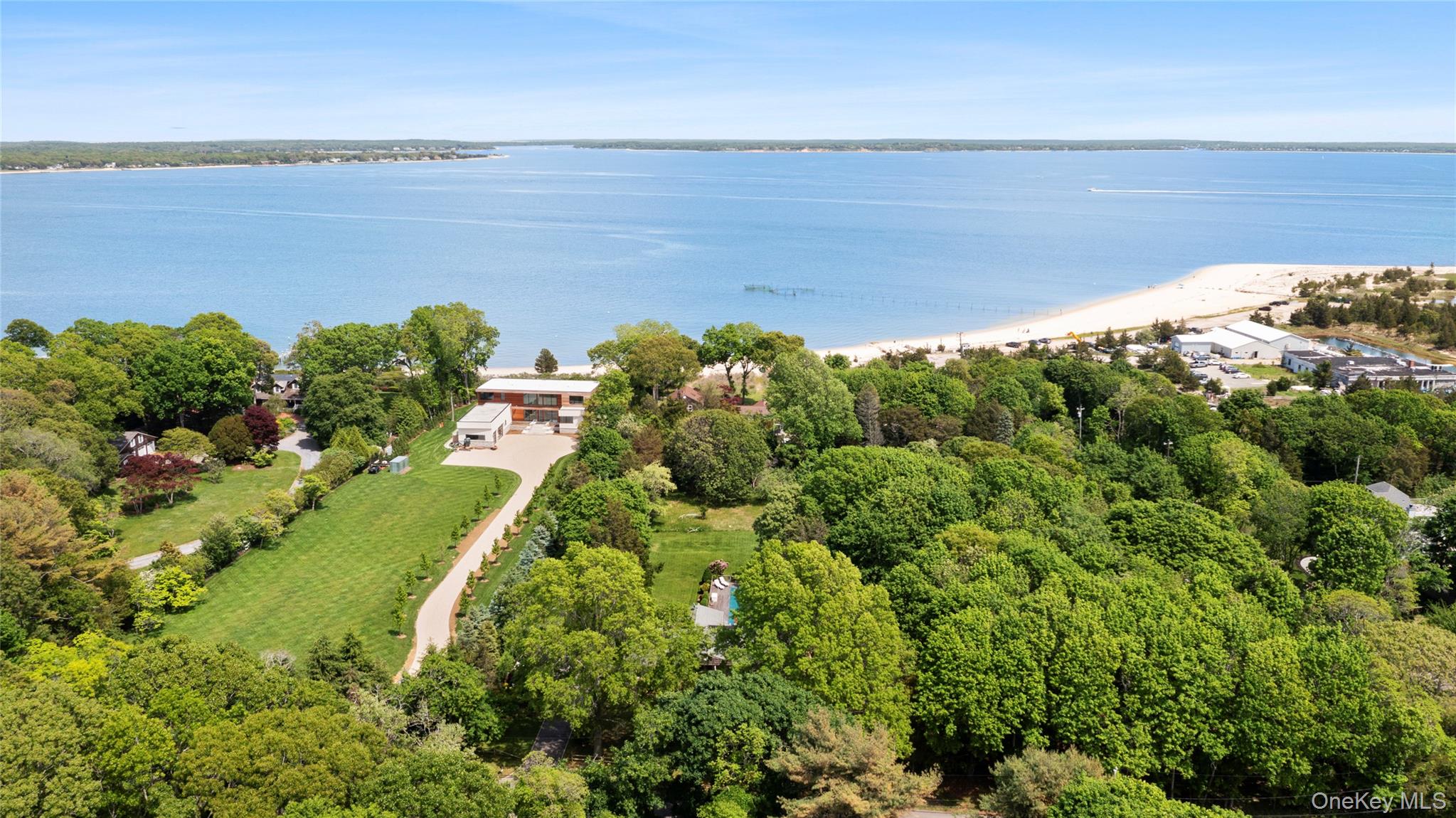 250 Paradise Point Road Southold, NY 11971 - Photo 2 of 24 a view of a lake with a yard