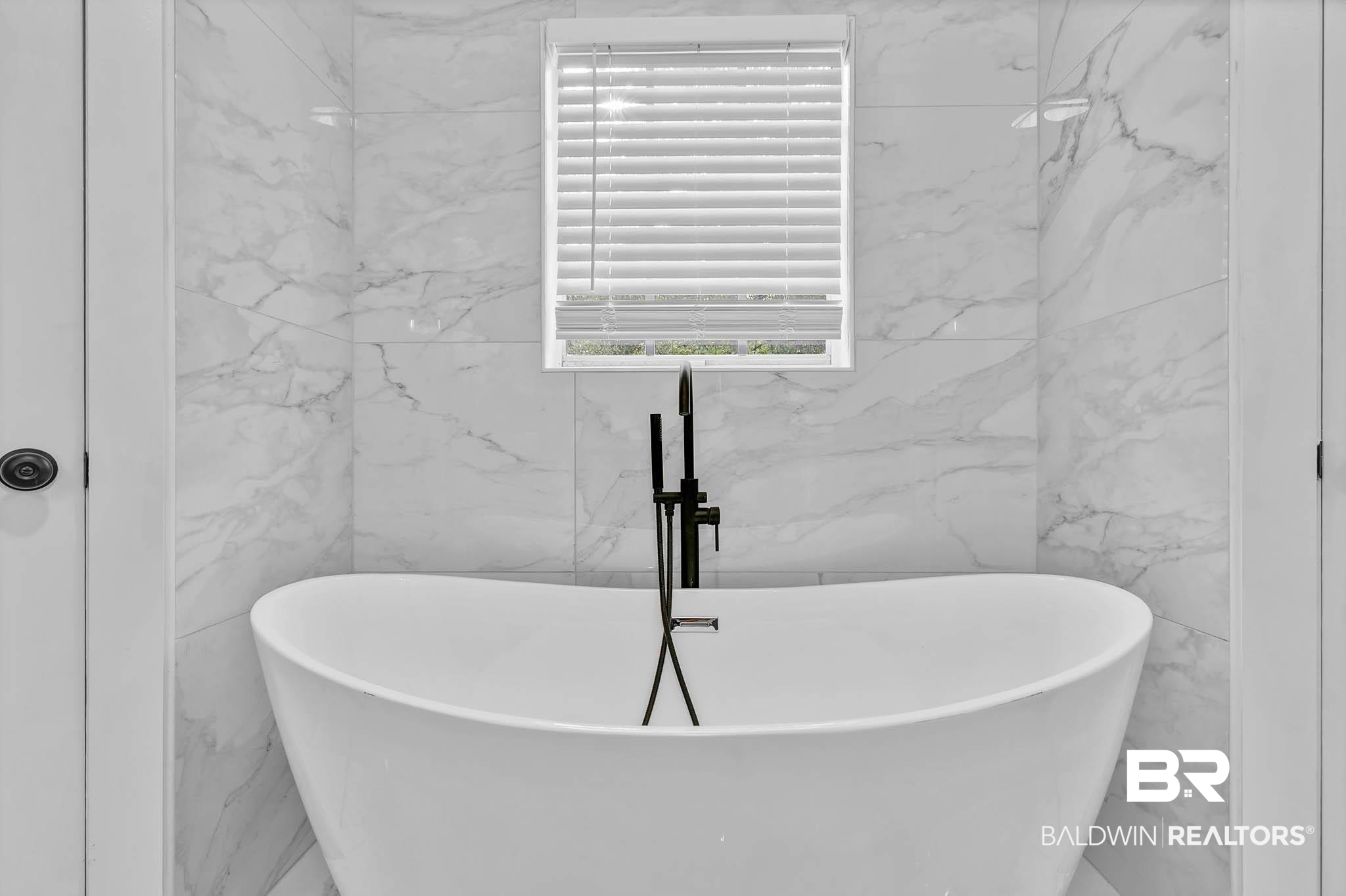 4705 Sherry Court Mobile, AL 36693 - Photo 43 of 100 Bathroom with a freestanding tub and marble tiled floors