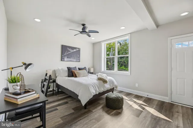 a bed room with a bed and a window