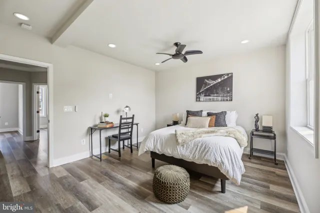 a bedroom with a bed and a table