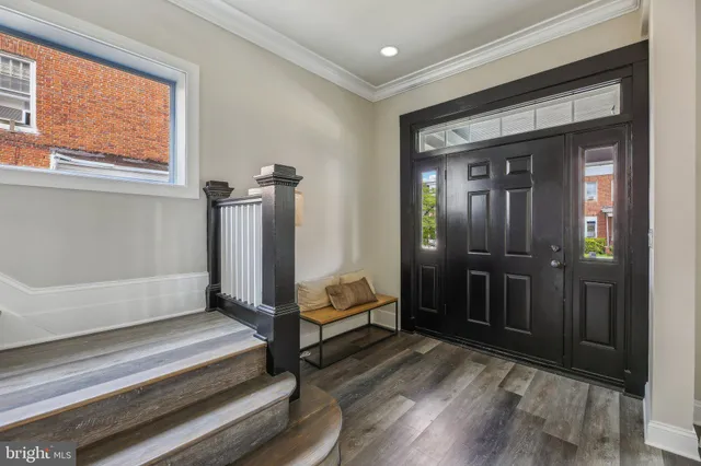 a spacious bedroom with a bed and a window