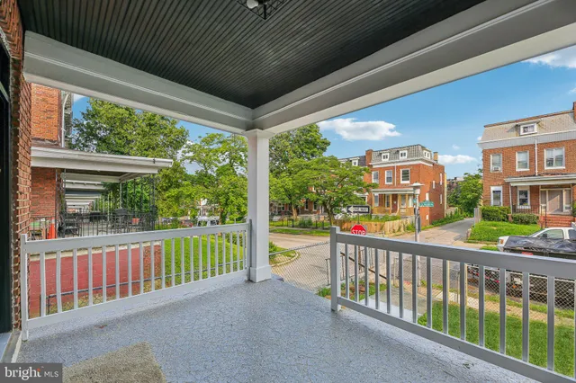 a view of a street from a balcony