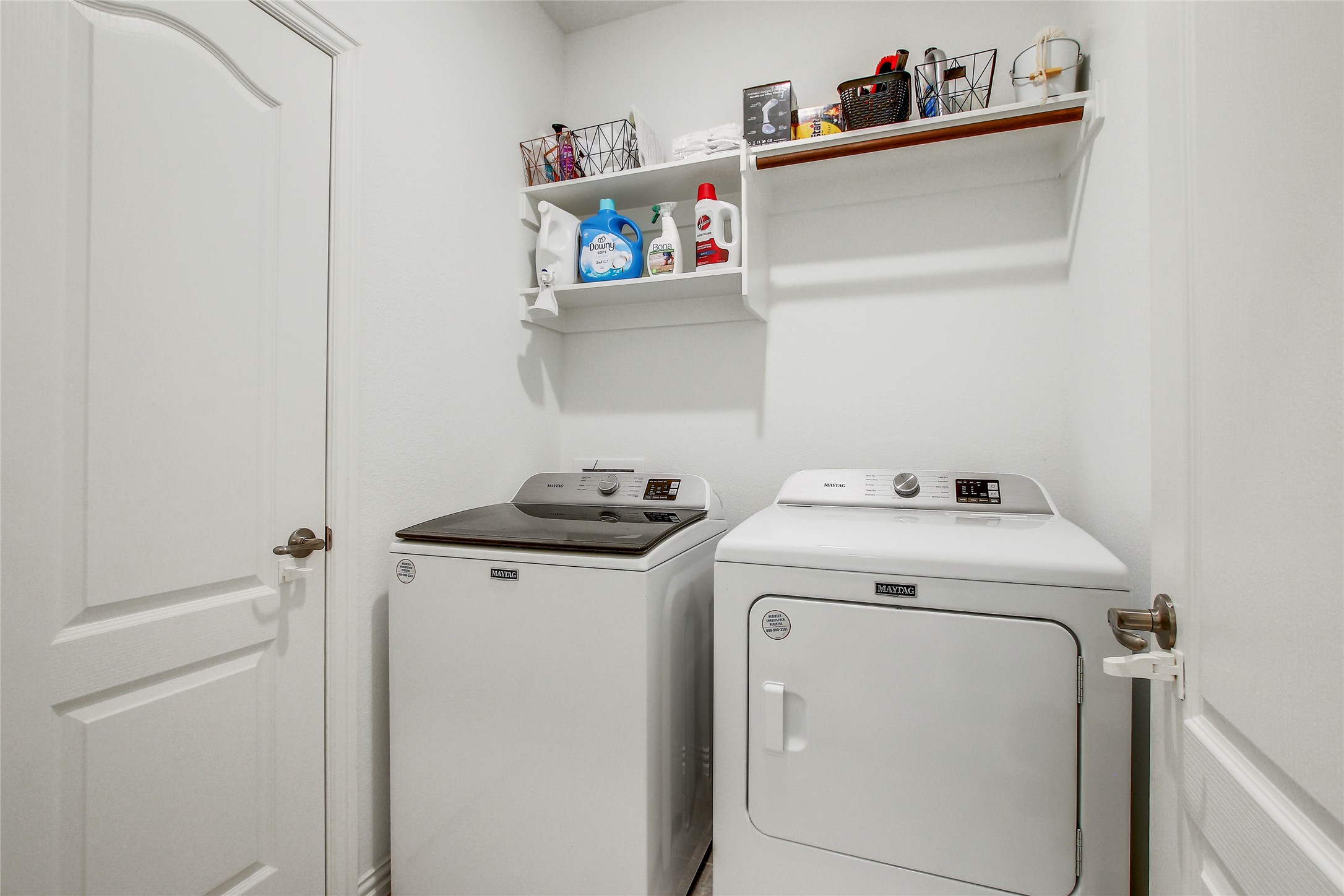 104 Millbend Road Georgetown, TX 78633 - Photo 24 of 40 A dedicated laundry space equipped with essential appliances and convenient overhead shelving.