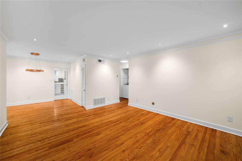 3510 Roswell Road Northwest, Unit M4 Atlanta, GA 30305 - Photo 5 of 23 a view of an empty room with wooden floor