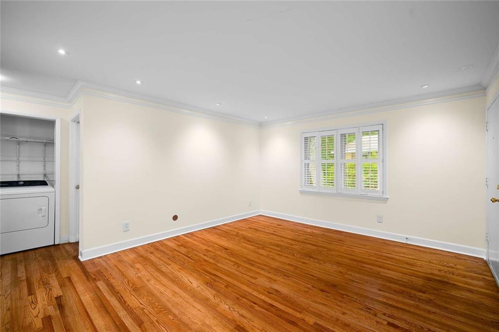 3510 Roswell Road Northwest, Unit M4 Atlanta, GA 30305 - Photo 7 of 23 an empty room with wooden floor and windows