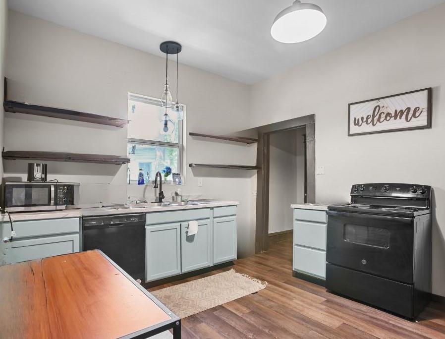 504 Preston Street Waco, TX 76704 - Photo 3 of 14 a kitchen with a sink stove and cabinets