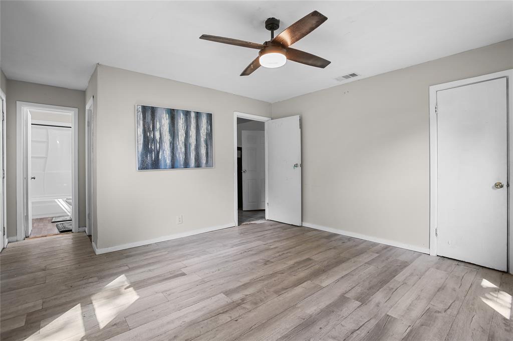 504 Preston Street Waco, TX 76704 - Photo 5 of 14 a view of empty room with wooden floor