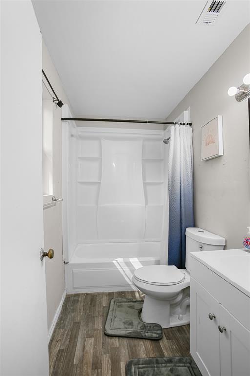504 Preston Street Waco, TX 76704 - Photo 7 of 14 a bathroom with a toilet and a shower