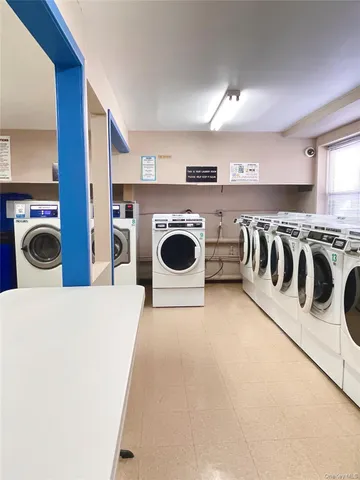 a view of a kitchen with refrigerator and stove