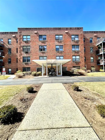 a front view of building with outdoor space