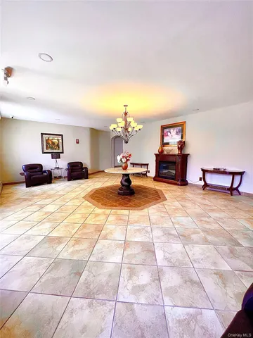 a bed room with a bed and a chair