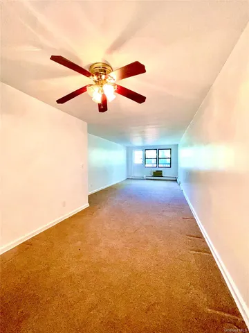 a view of a big room with carpet