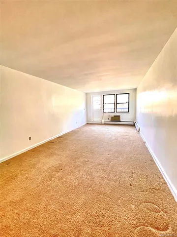 a view of a big room with an entryway