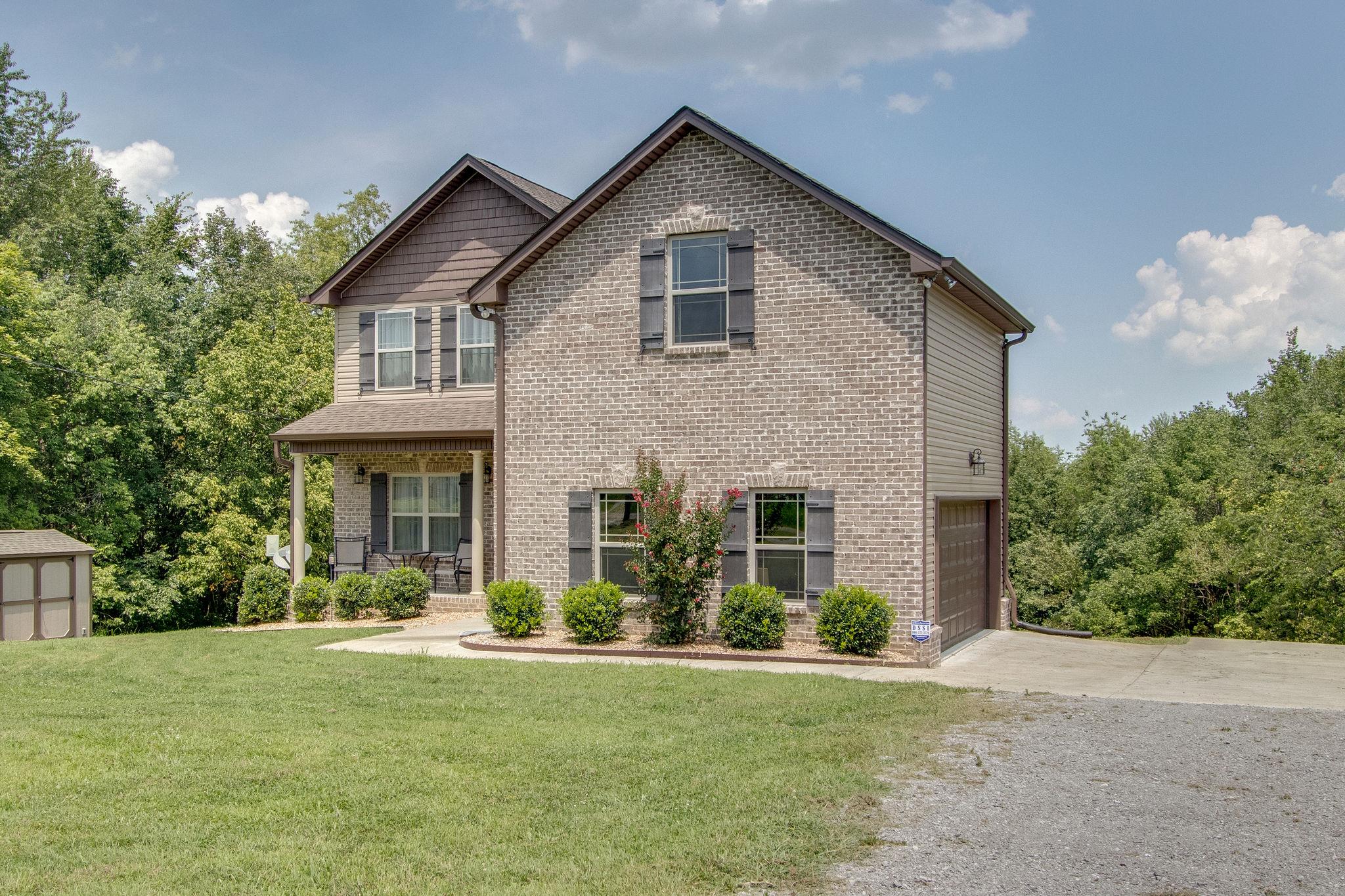 4121 Beasleys Bend Road Lebanon, TN 37087 - Photo 2 of 28 a front view of a house with garden