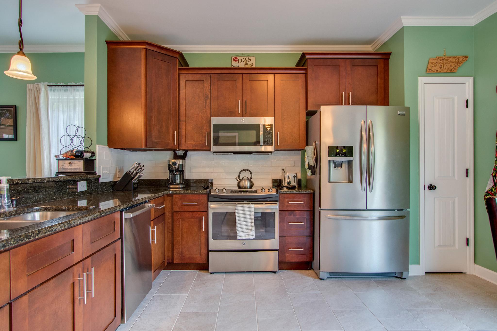 4121 Beasleys Bend Road Lebanon, TN 37087 - Photo 11 of 28 a kitchen with stainless steel appliances granite countertop a refrigerator stove a sink and a microwave