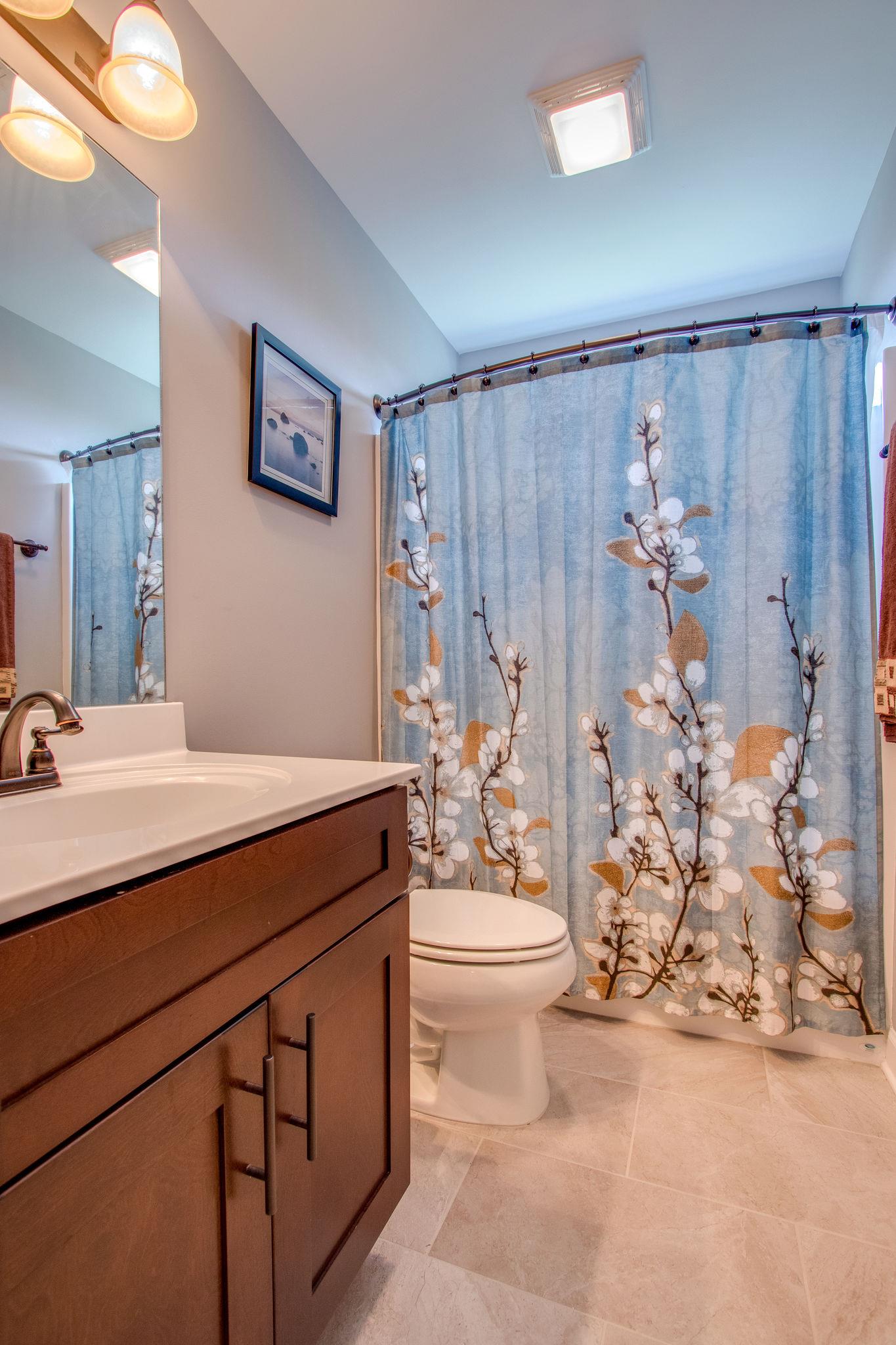 4121 Beasleys Bend Road Lebanon, TN 37087 - Photo 16 of 28 a bathroom with a sink toilet and shower