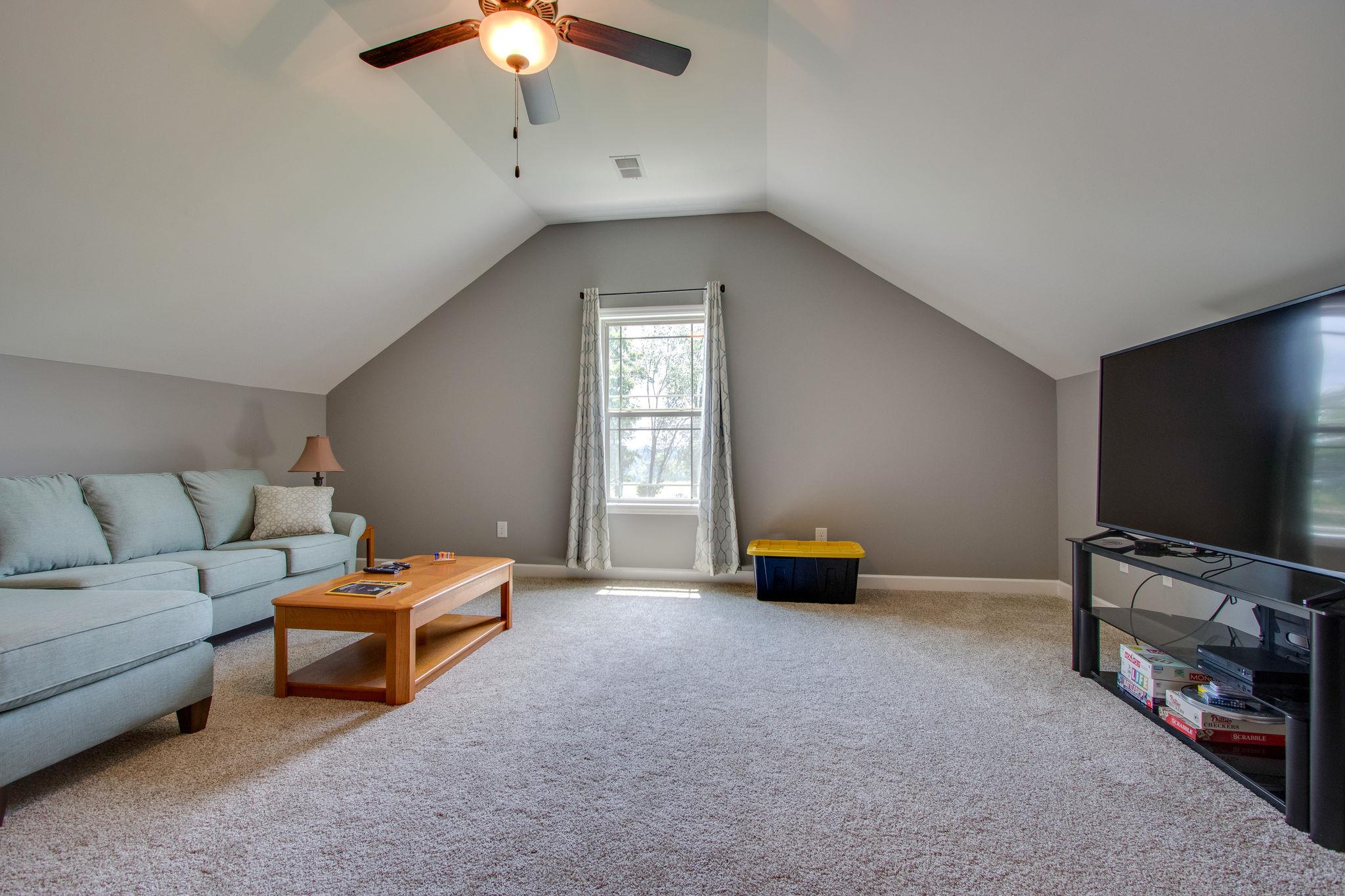 4121 Beasleys Bend Road Lebanon, TN 37087 - Photo 18 of 28 a bedroom with furniture and a flat screen tv