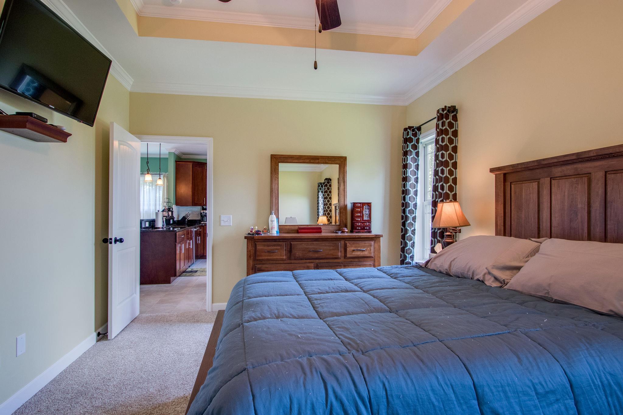 4121 Beasleys Bend Road Lebanon, TN 37087 - Photo 21 of 28 a bedroom with a bed and a flat screen tv