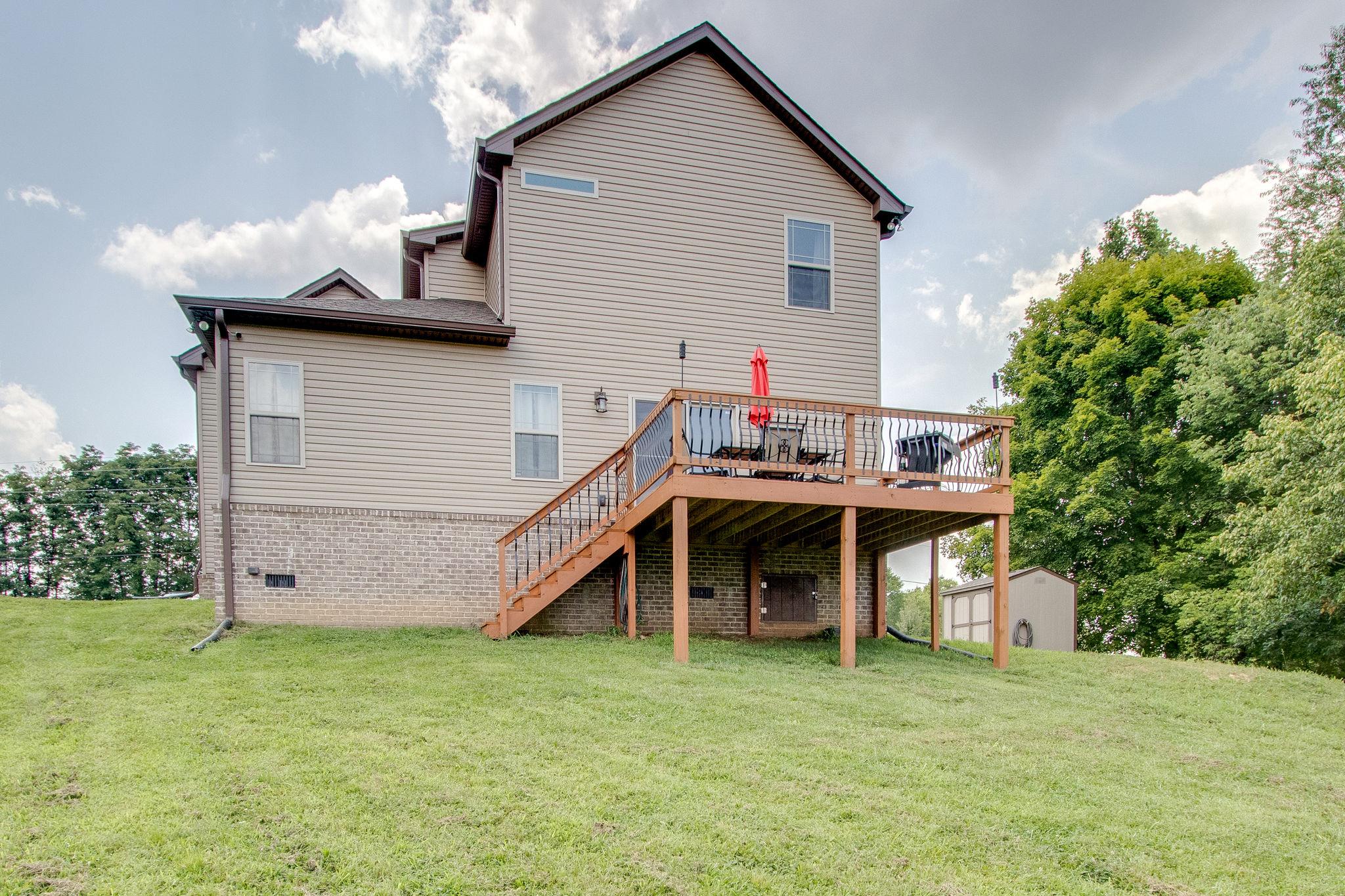 4121 Beasleys Bend Road Lebanon, TN 37087 - Photo 24 of 28 a view of a house with a backyard and a patio
