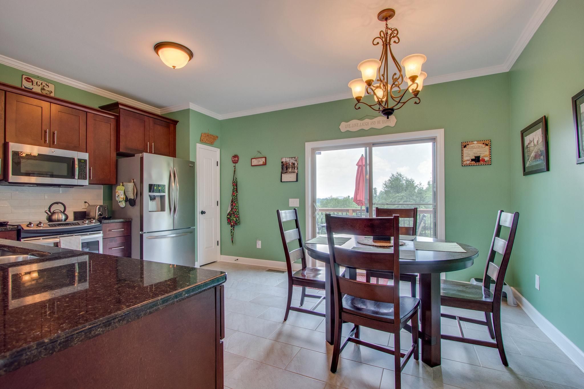 4121 Beasleys Bend Road Lebanon, TN 37087 - Photo 10 of 28 a view of a dining room with furniture a chandelier and window