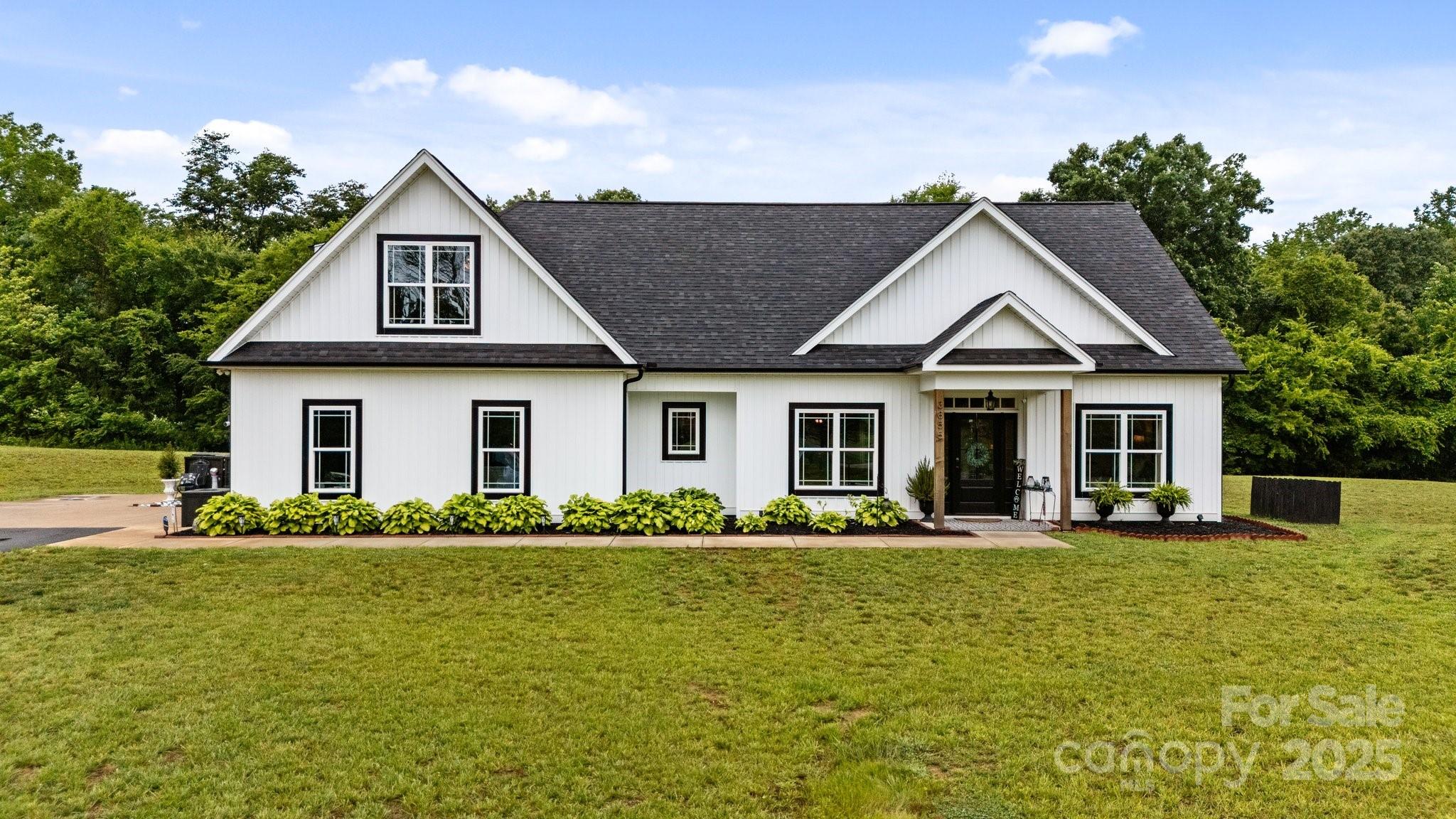 3855 East Holly Grove Road Lexington, NC 27292 - Photo 1 of 42 a front view of a house with a yard