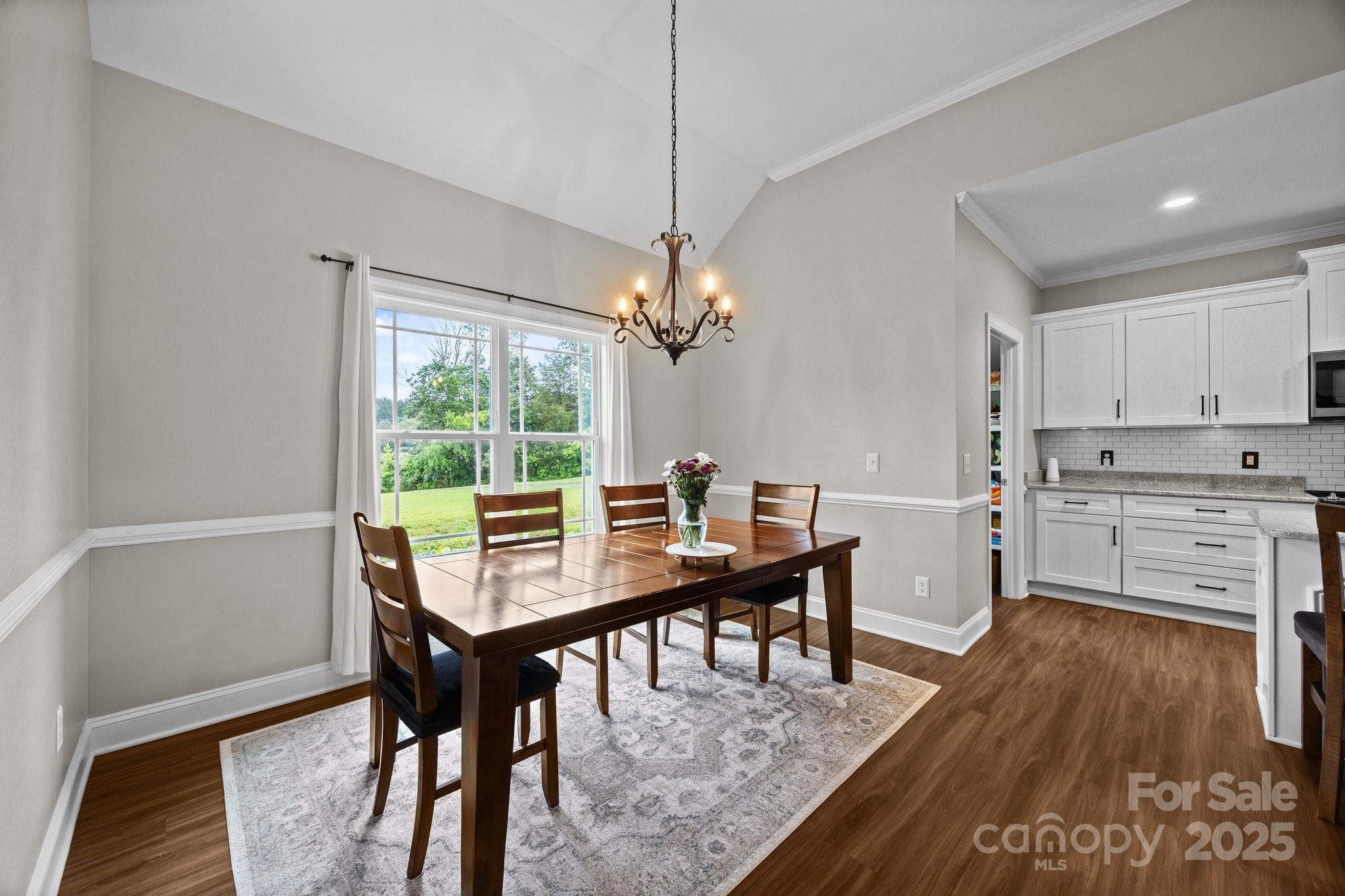 3855 East Holly Grove Road Lexington, NC 27292 - Photo 11 of 42 a view of a dining room with furniture window and wooden floor