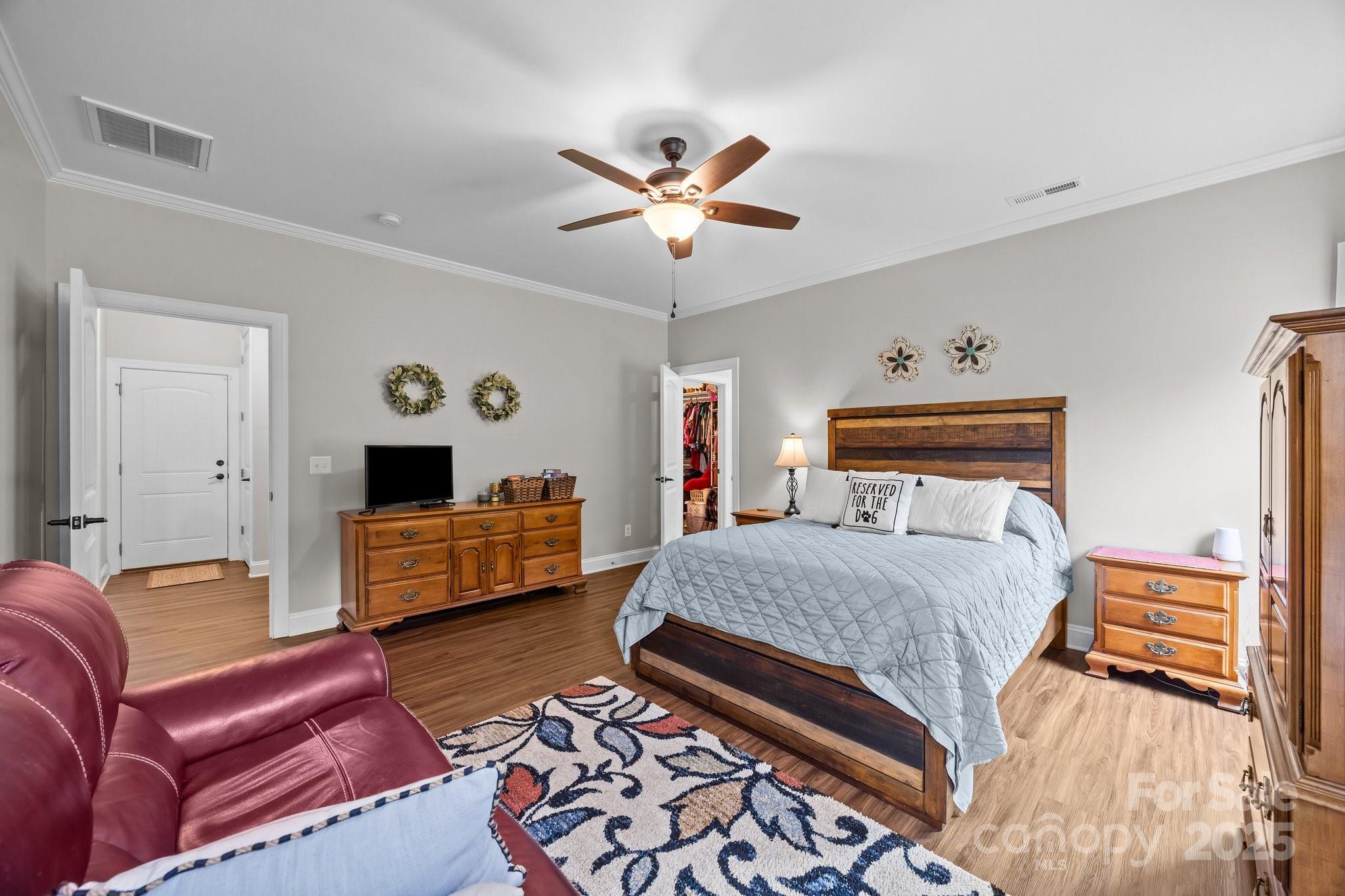 3855 East Holly Grove Road Lexington, NC 27292 - Photo 14 of 42 a bedroom with a bed and wooden floor