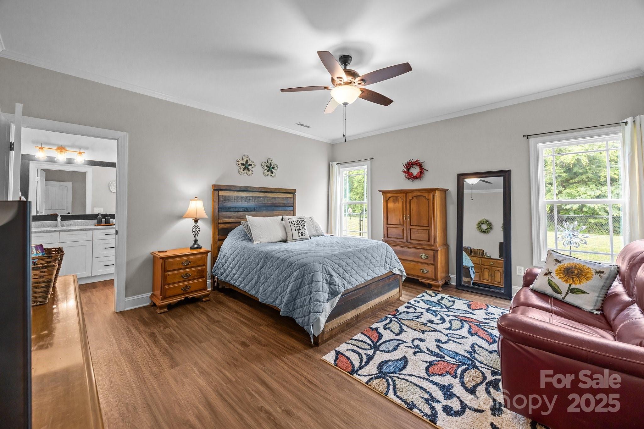 3855 East Holly Grove Road Lexington, NC 27292 - Photo 15 of 42 a spacious bedroom with a bed and wooden floor