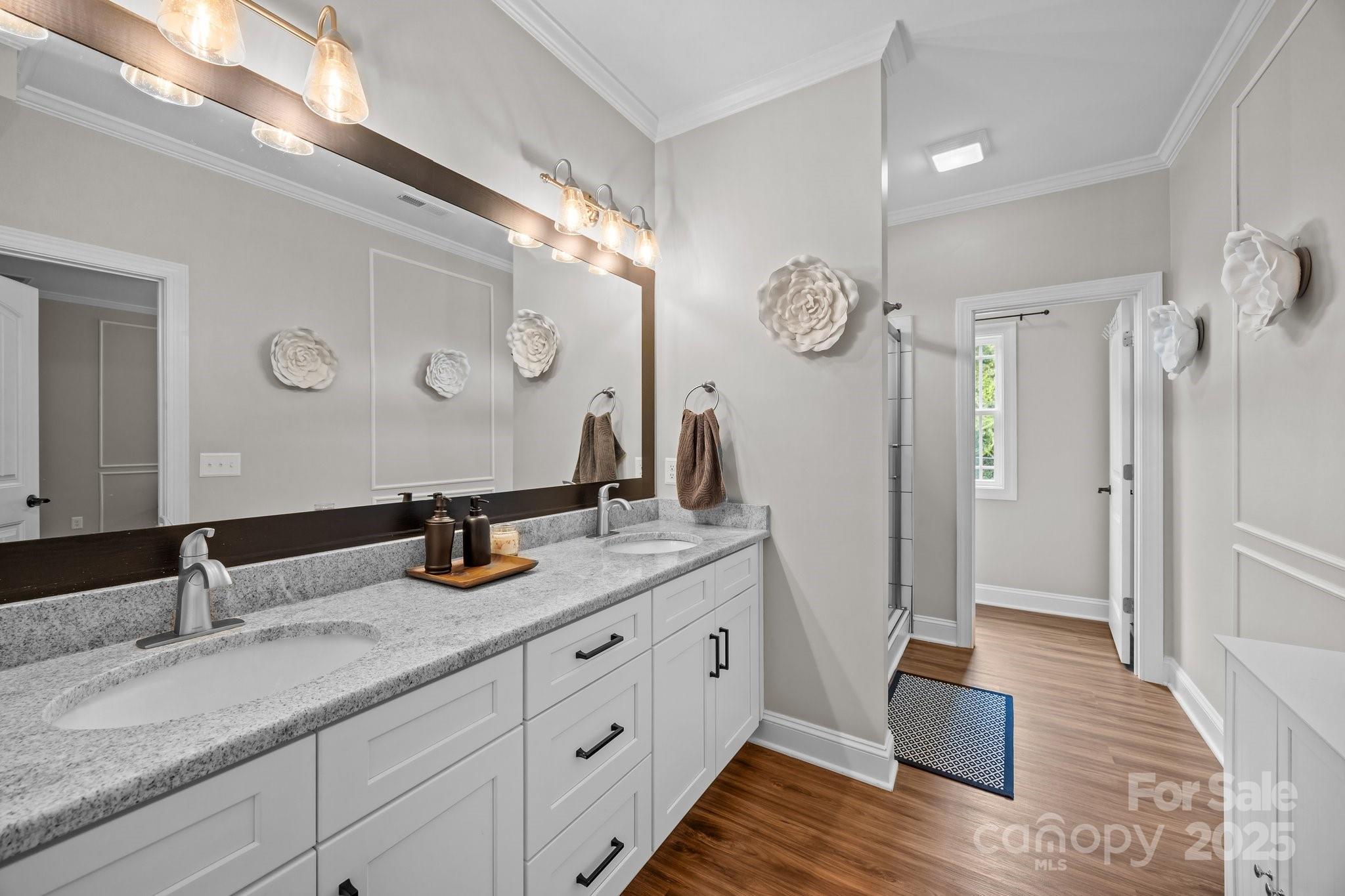 3855 East Holly Grove Road Lexington, NC 27292 - Photo 16 of 42 a bathroom with double vanity sink and mirror