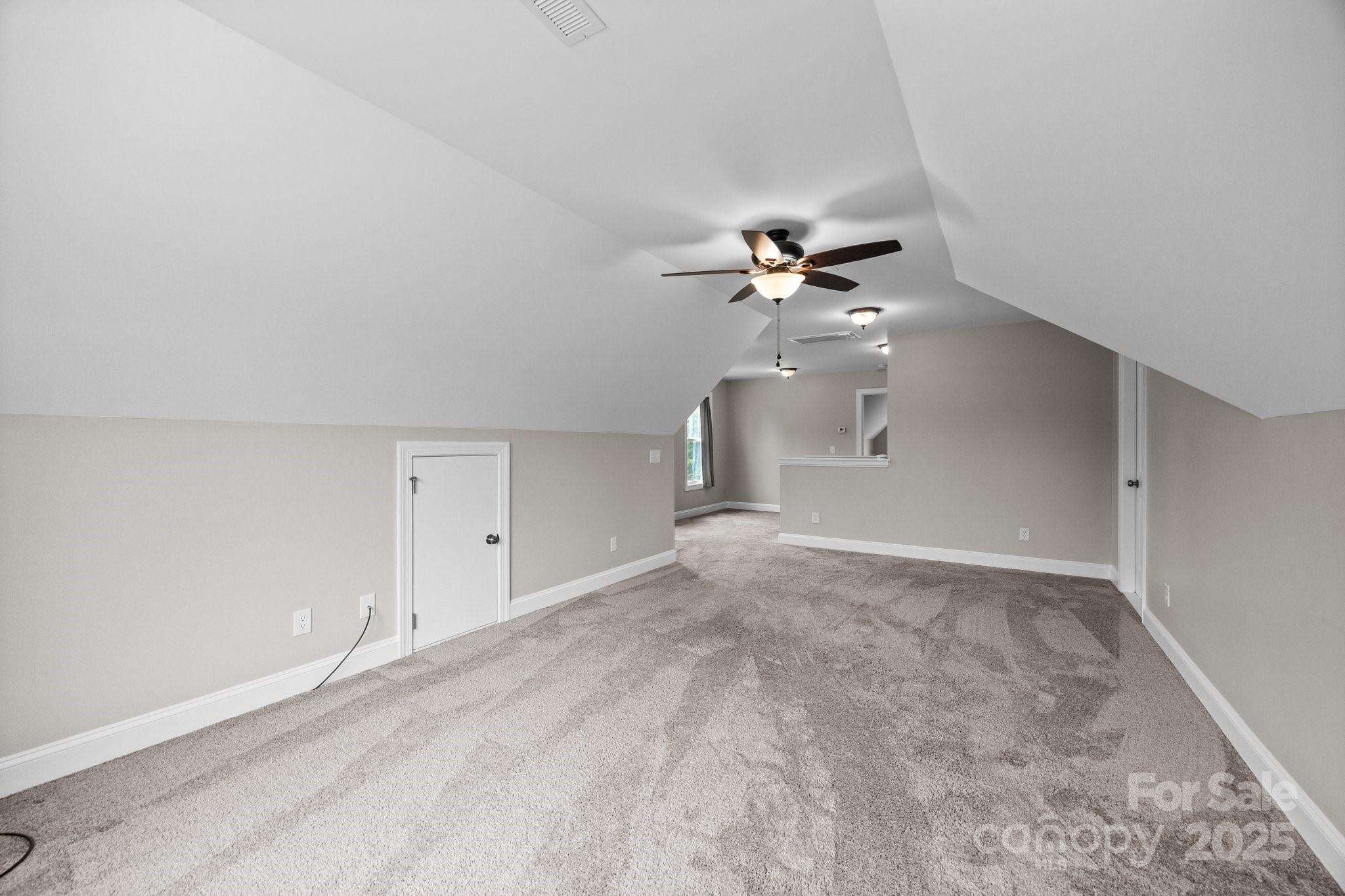 3855 East Holly Grove Road Lexington, NC 27292 - Photo 26 of 42 a view of an empty room with a chandelier fan