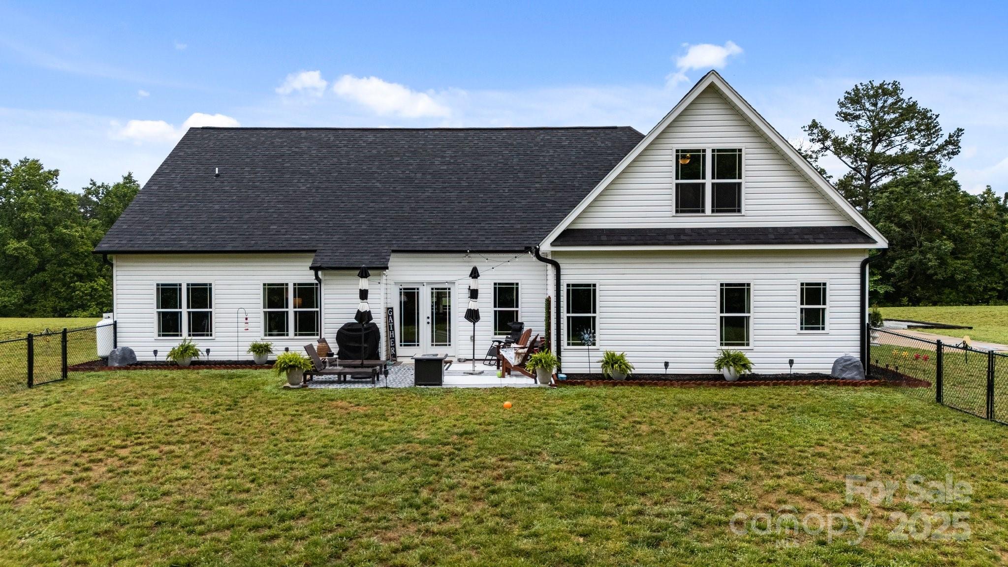 3855 East Holly Grove Road Lexington, NC 27292 - Photo 31 of 42 a front view of house with yard and trees in the background
