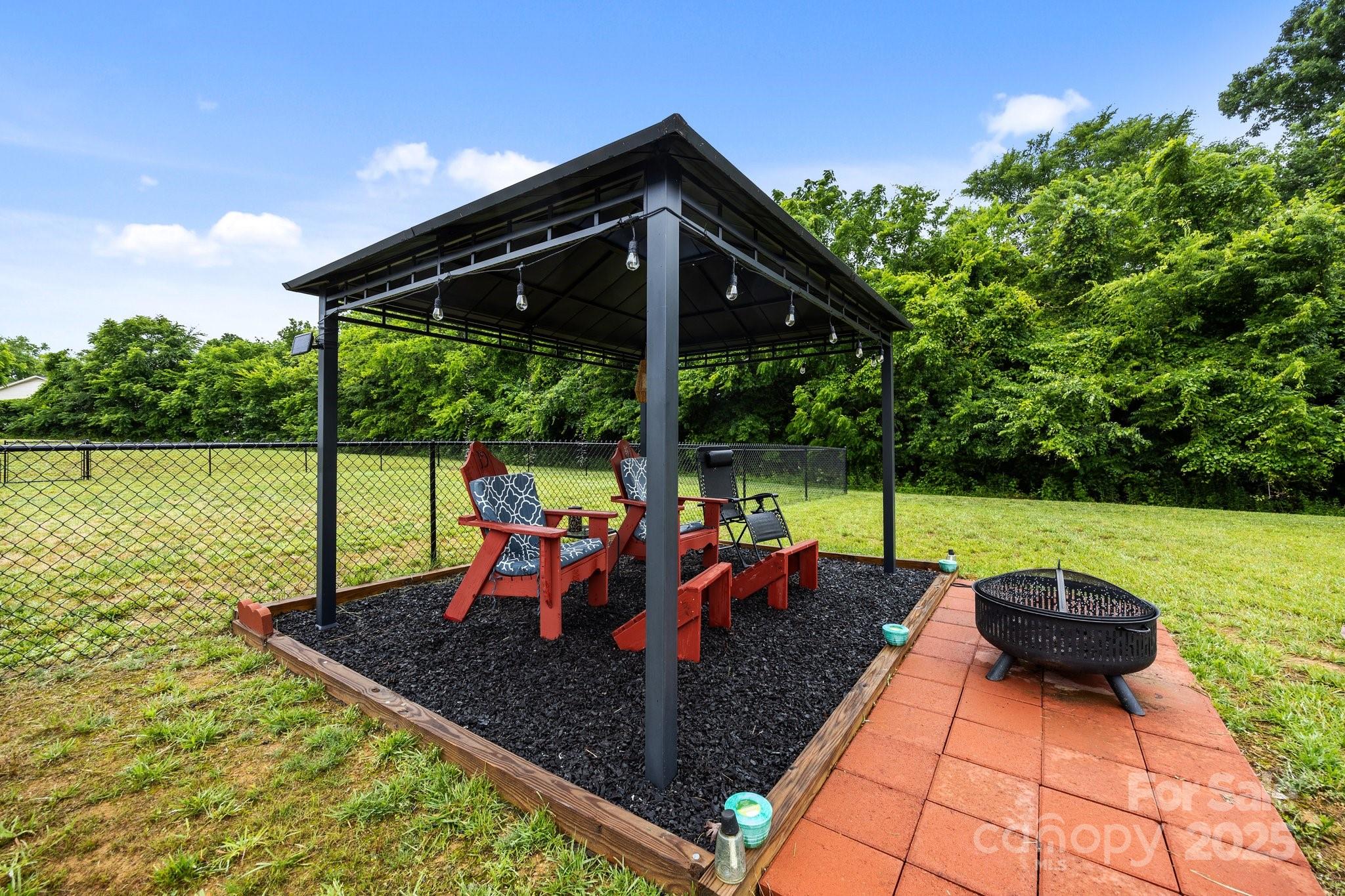 3855 East Holly Grove Road Lexington, NC 27292 - Photo 37 of 42 a view of a backyard with sitting area